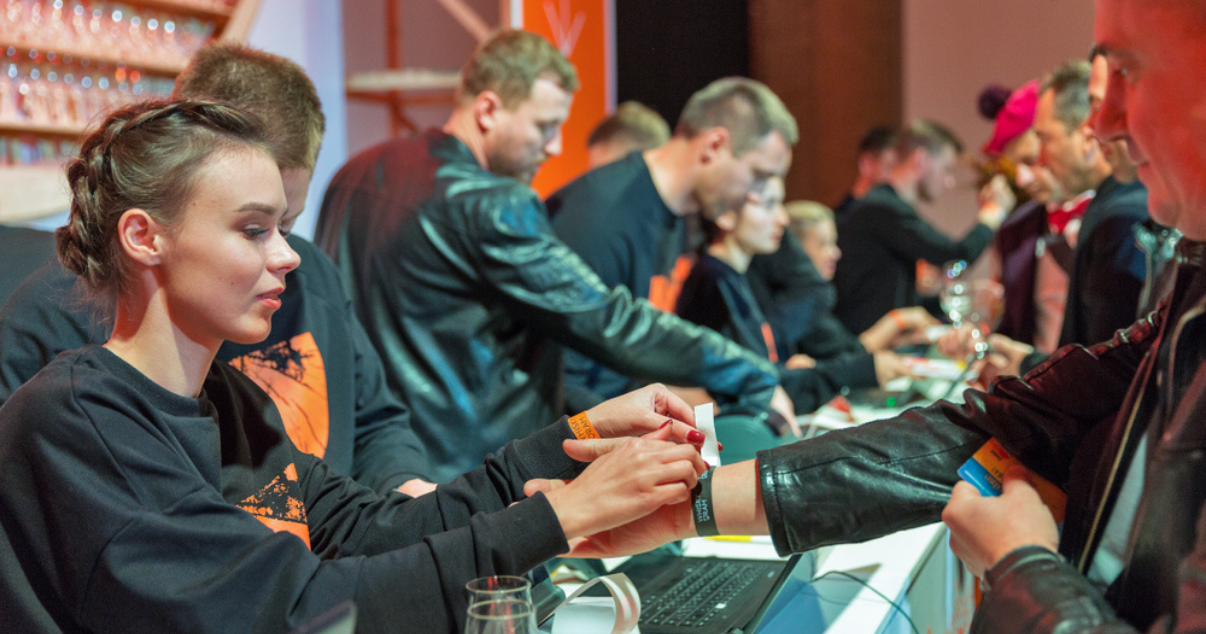 Group of event volunteers working at the ticket booth