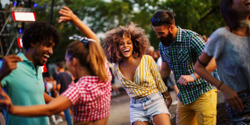 People dancing at a concert.