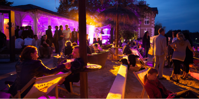 Outdoor event on the beach at nighttime