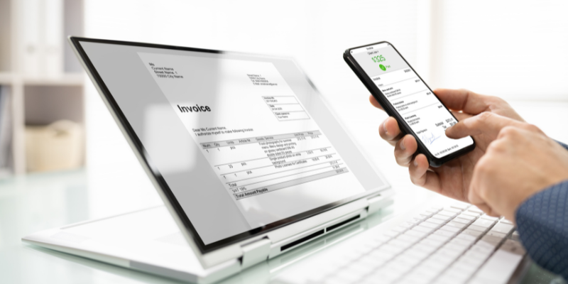 Online digital e-invoice system shown on a laptop and mobile phone