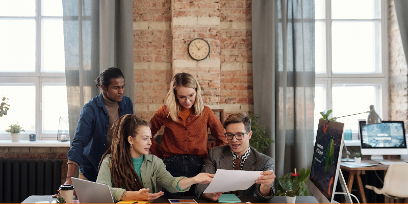 Group of people discussing business in a modern office