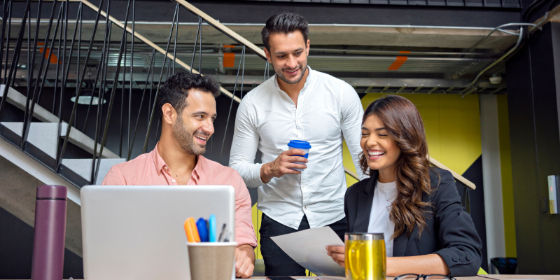 Three coworkers discuss business related issues