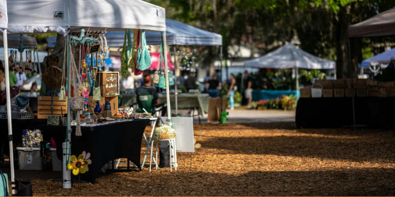 Market stall tents with local goods outdoors