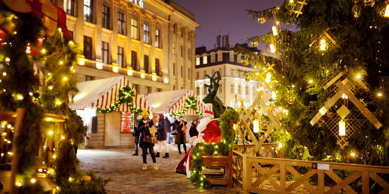 People enjoying an authentic outdoor Christmas market at night