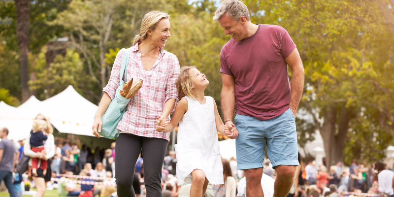 Family relaxing at an outdoor summer event