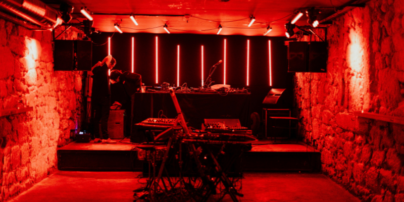 Red-lit underground music venue