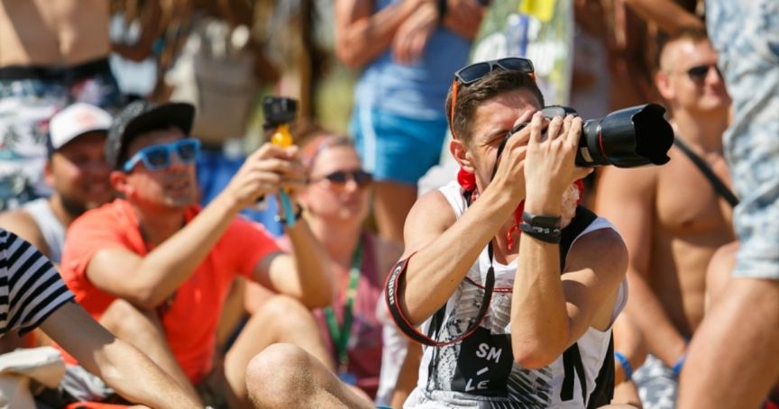 Event photographer trying to get the best shots for event content without bothering guests