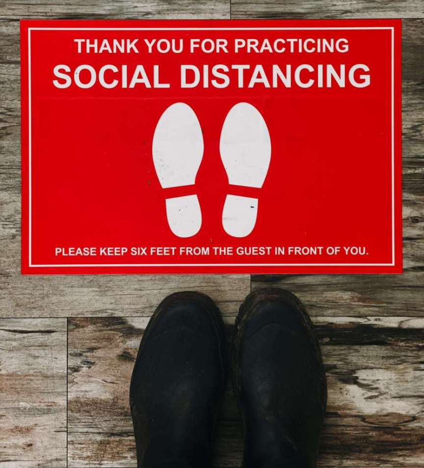 Social distancing sign on floor