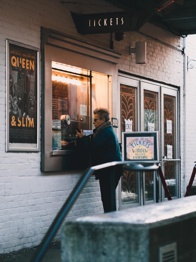 Man visiting concert box office