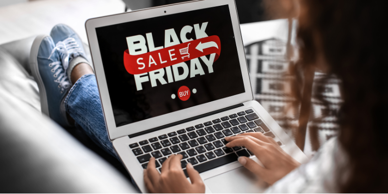 Young woman shopping online on Black Friday at home