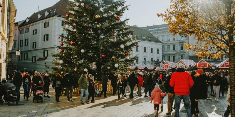 Festive Christmas market with a crowd dressed warmly