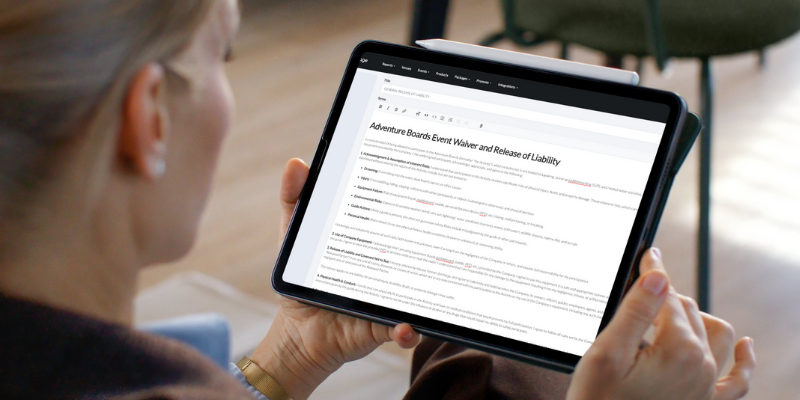 Close-up shot of a woman reading a Liability Waiver on her tablet