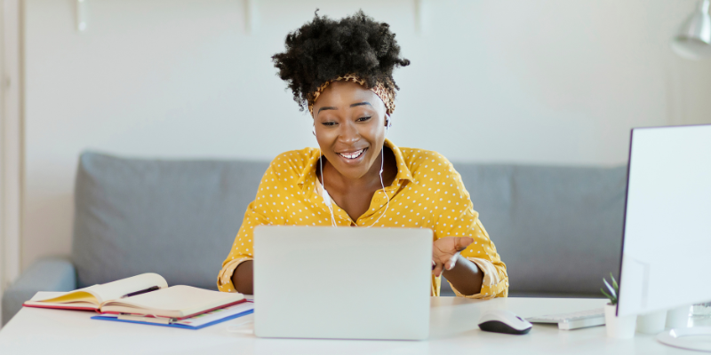 Woman working on a laptop doing event planning